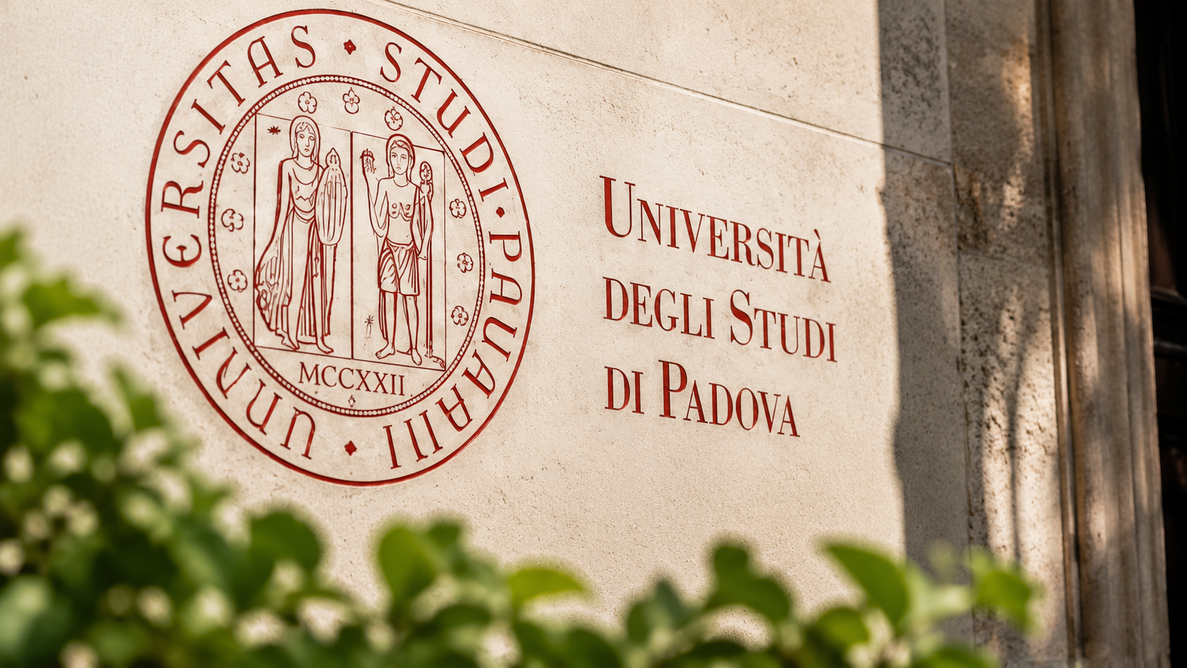 Università degli Studi di Padova seal on a historic stone wall